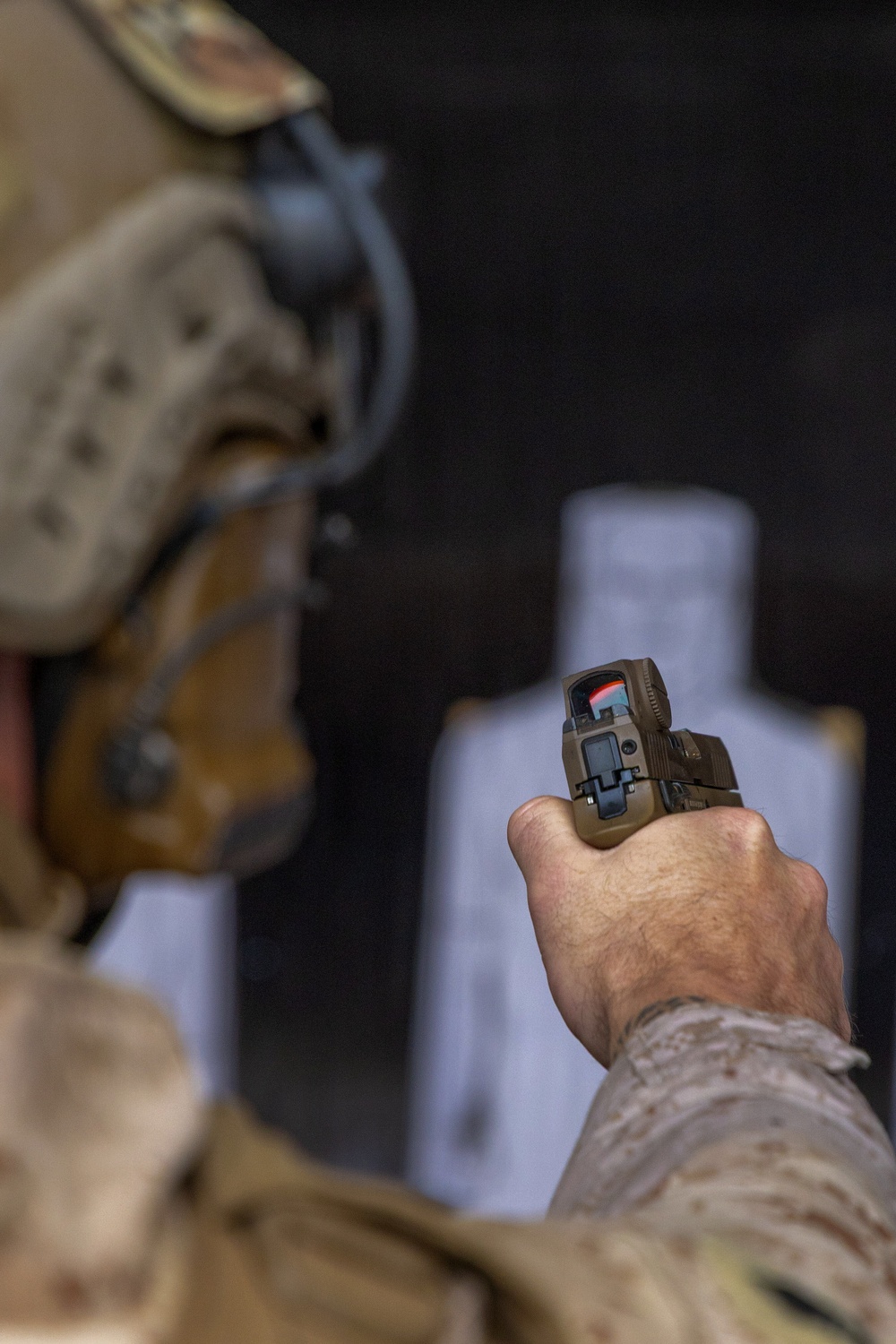 Reconnaissance Marines with the 24th Marine Expeditionary Unit conduct pistol and rifle shooting drills as a part of a modified qualification for Close Quarters Tactics training.