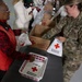 First Lady Melania Trump and Second Lady Usha Vance Partner with Red Cross Making Care Packages at Andrews