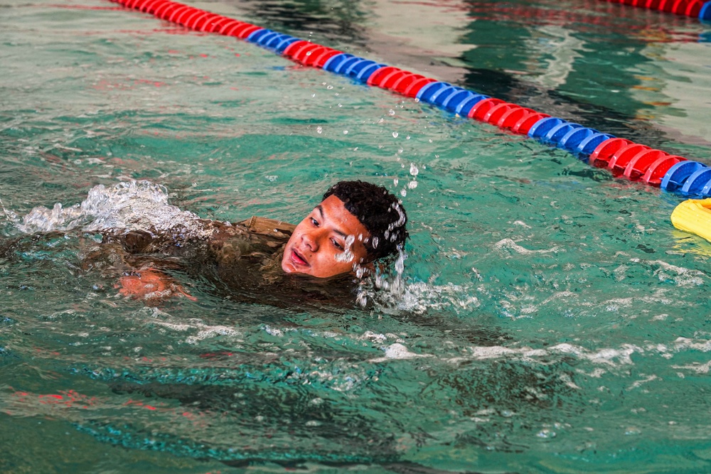 A Civil Affairs Soldier Swims Through a Water Survival Exercise at a German Armed Forces Proficiency Badge (GAFPB) Competition