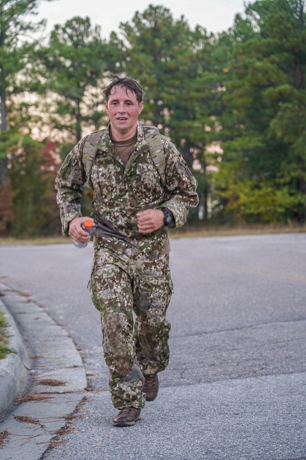Senior German Armed Forces Non-Commissioned Officer Administers and Competes in a German Armed Forces Proficiency Badge (GAFPB) Competition Alongside Civil Affairs Soldiers