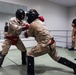 U.S. Marines with Camp Blaz participate in standing and striking during a green belt advancement