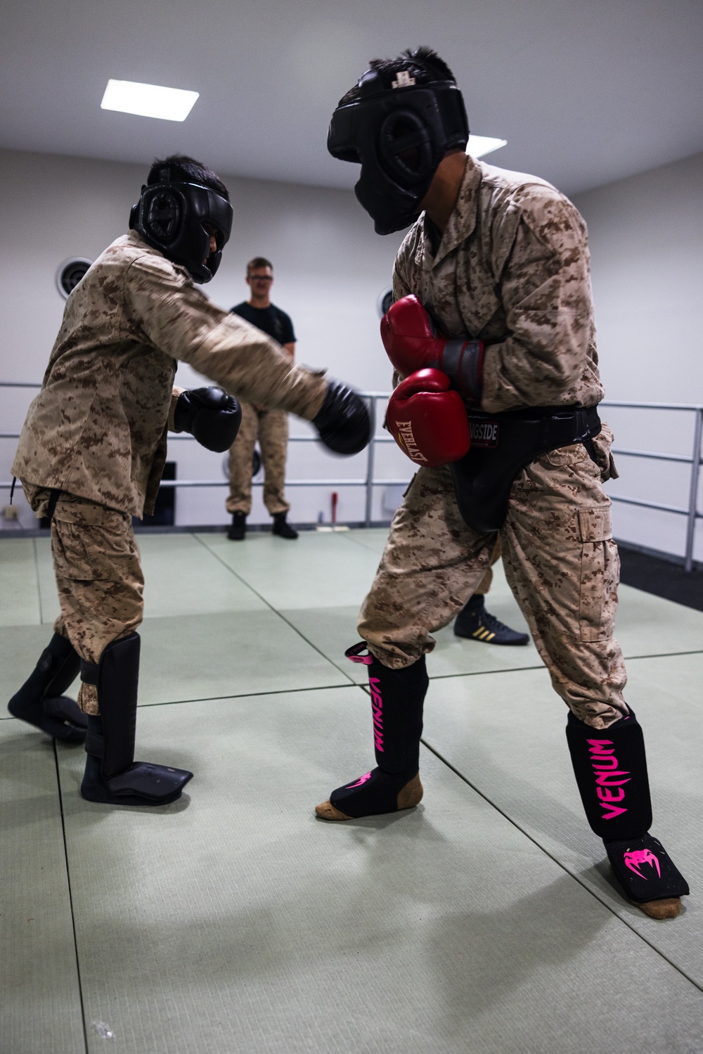 U.S. Marines with Camp Blaz participate in standing and striking during a green belt advancement