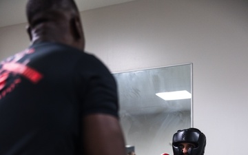 U.S. Marines with Camp Blaz participate in standing and striking during a green belt advancement