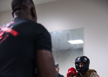 U.S. Marines with Camp Blaz participate in standing and striking during a green belt advancement