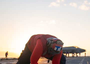 USS Tripoli Conducts Sunset Flight Operations