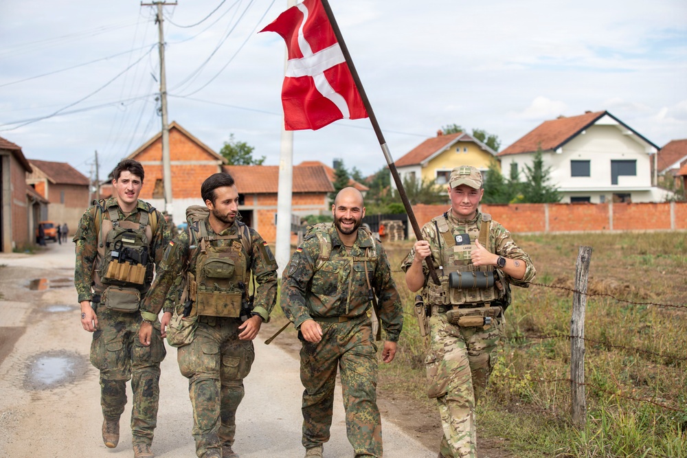 KFOR Multinational Soldiers Test Endurance During Danish Contingent March