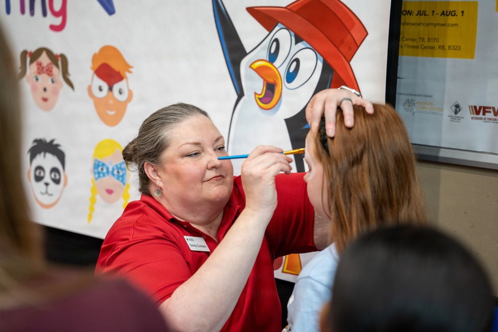 American Red Cross Volunteer Paints Child's Face