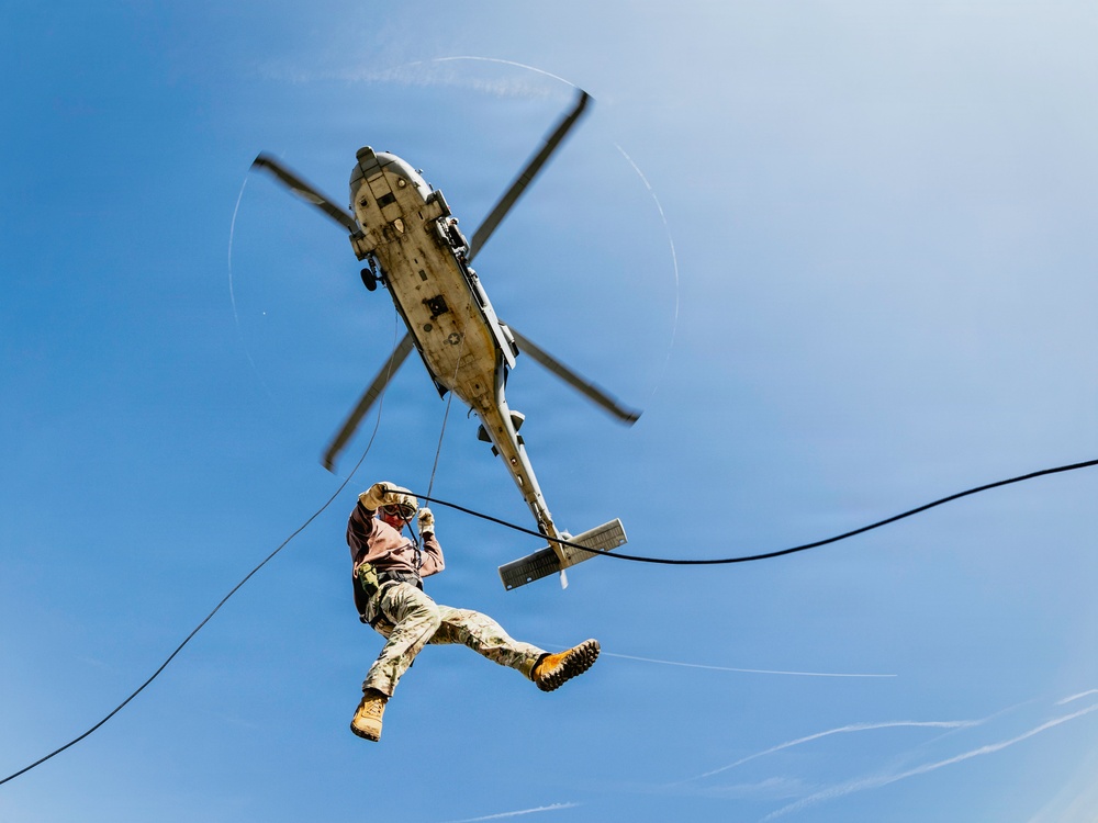 EOD Technicians Practice Daytime Rappelling and Fast-Roping Techniques