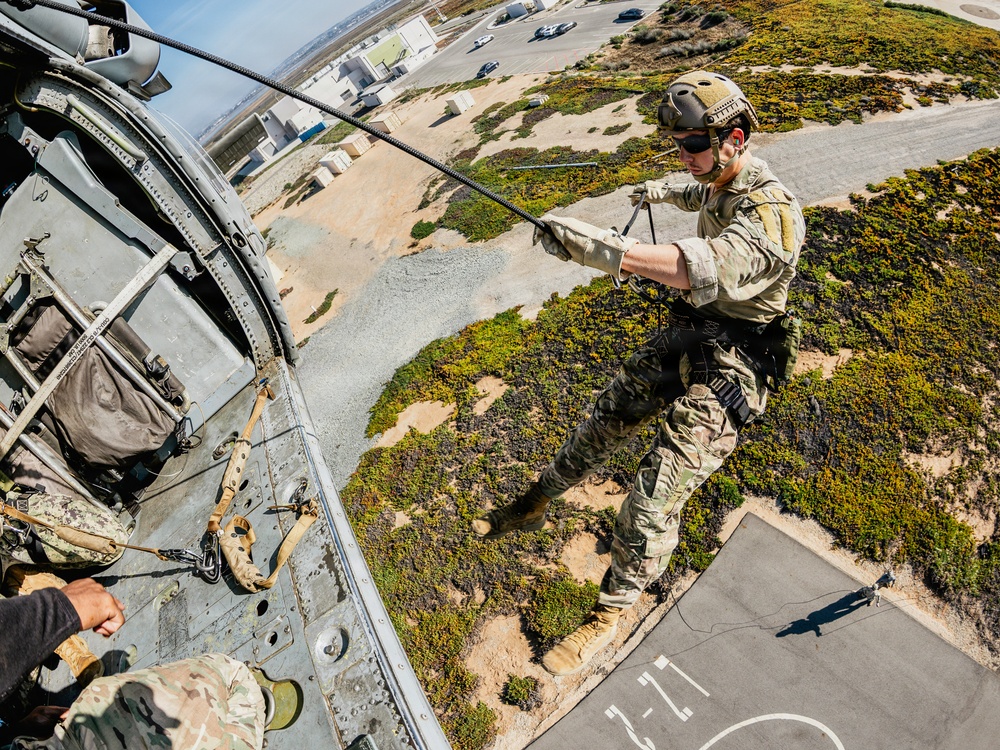 EOD Technicians Practice Daytime Rappelling and Fast-Roping Techniques
