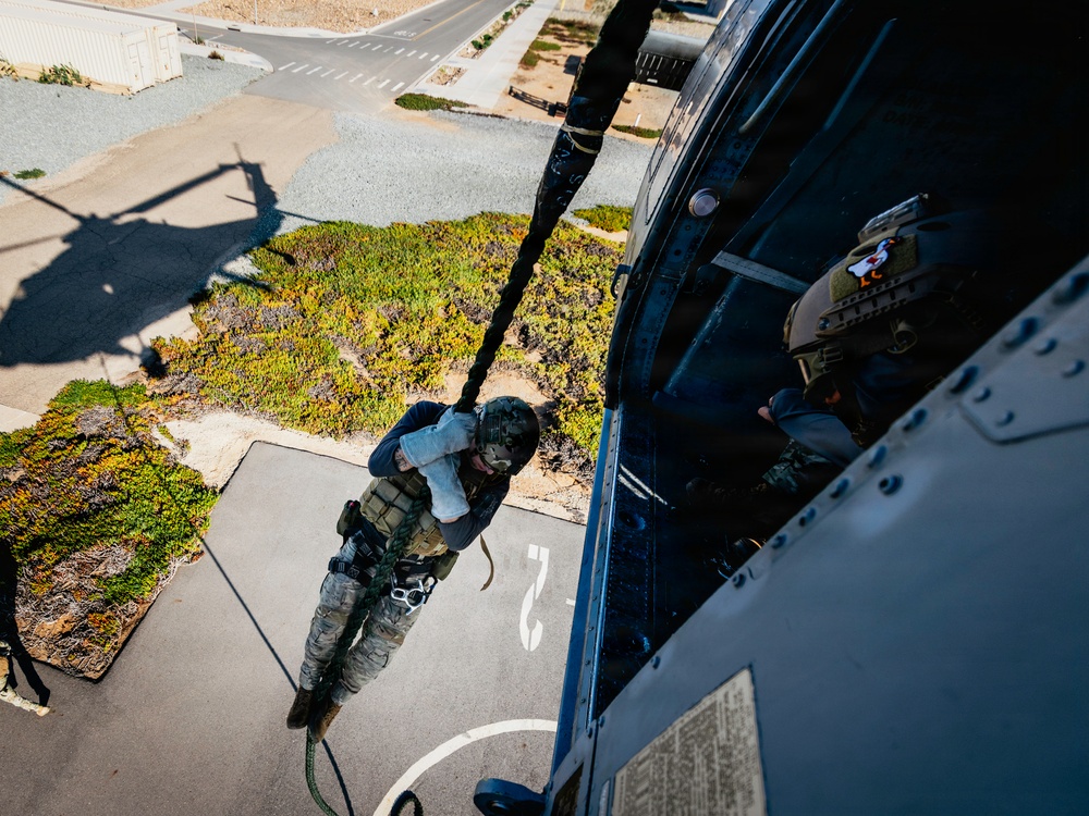 EOD Technicians Practice Daytime Rappelling and Fast-Roping Techniques