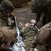 U.S. Navy Sailors alongside Finnish service members execute a simulated mass casualty response