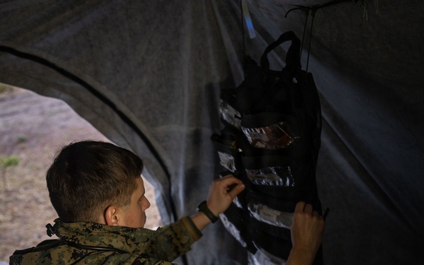 U.S. Navy Sailors alongside Finnish service members execute a simulated mass casualty response