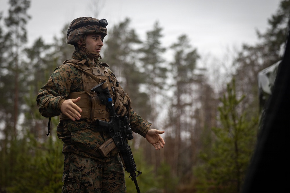 U.S. Navy Sailors alongside Finnish service members execute a simulated mass casualty response