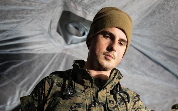 U.S. Navy Sailors alongside Finnish service members execute a simulated mass casualty response