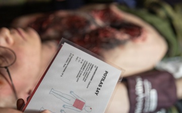 U.S. Navy Sailors alongside Finnish service members execute a simulated mass casualty response