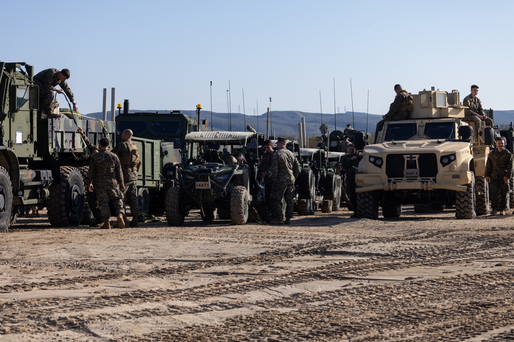 11th MEU Marines and Sailors embark equipment prior to a ship to shore movement