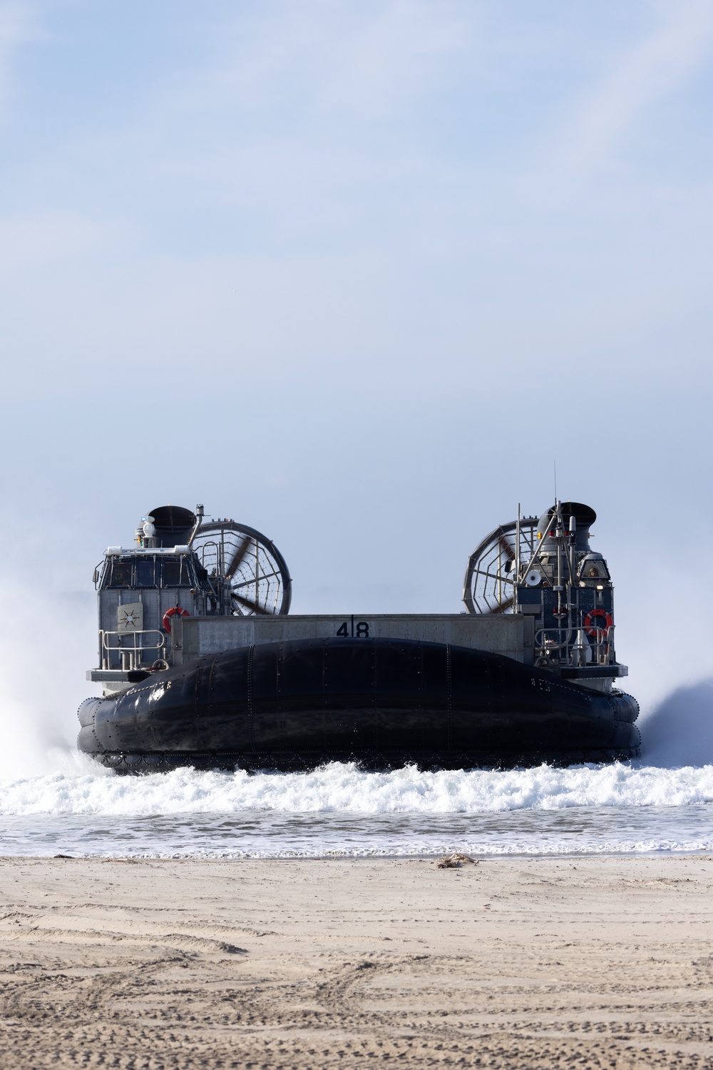 11th MEU Marines and Sailors embark equipment prior to a ship to shore movement