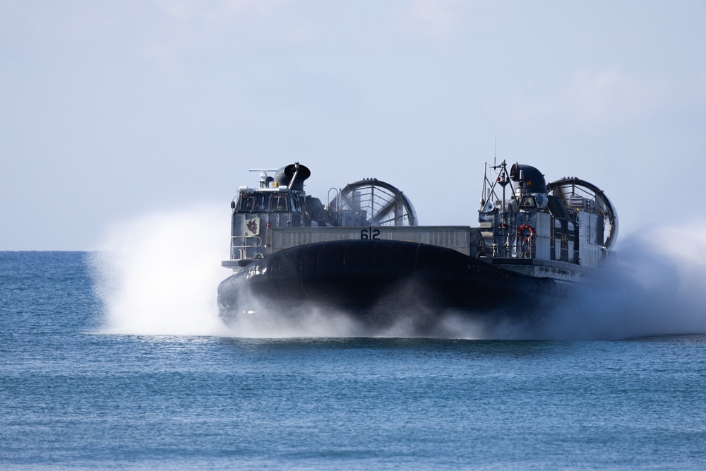 11th MEU Marines and Sailors embark equipment prior to a ship to shore movement