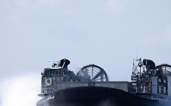 11th MEU Marines and Sailors embark equipment prior to a ship to shore movement