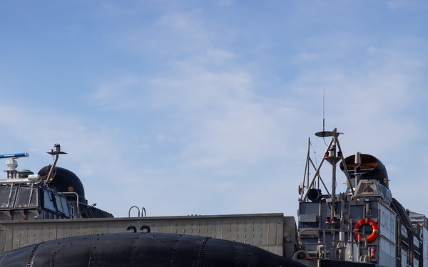 11th MEU Marines and Sailors embark equipment prior to a ship to shore movement