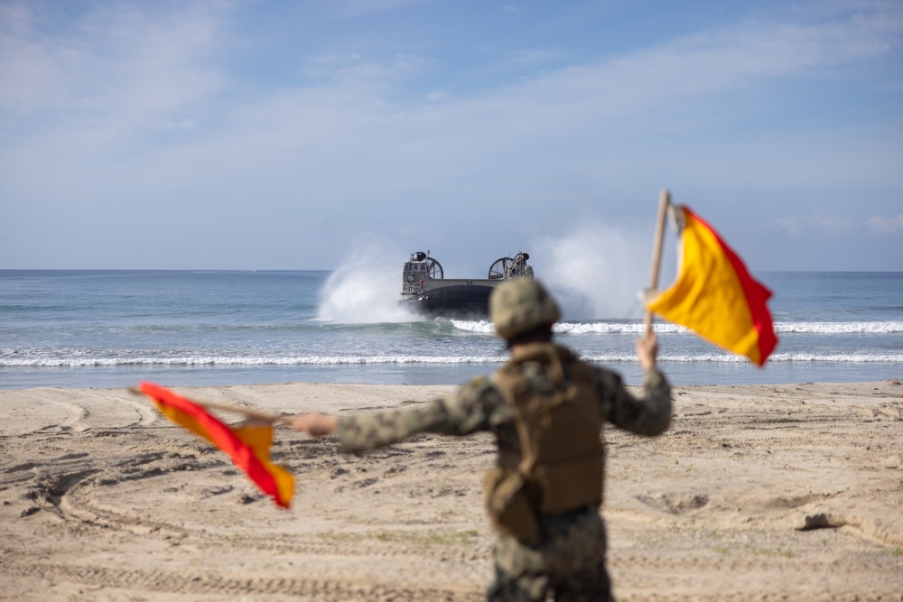 11th MEU Marines and Sailors embark equipment prior to a ship to shore movement