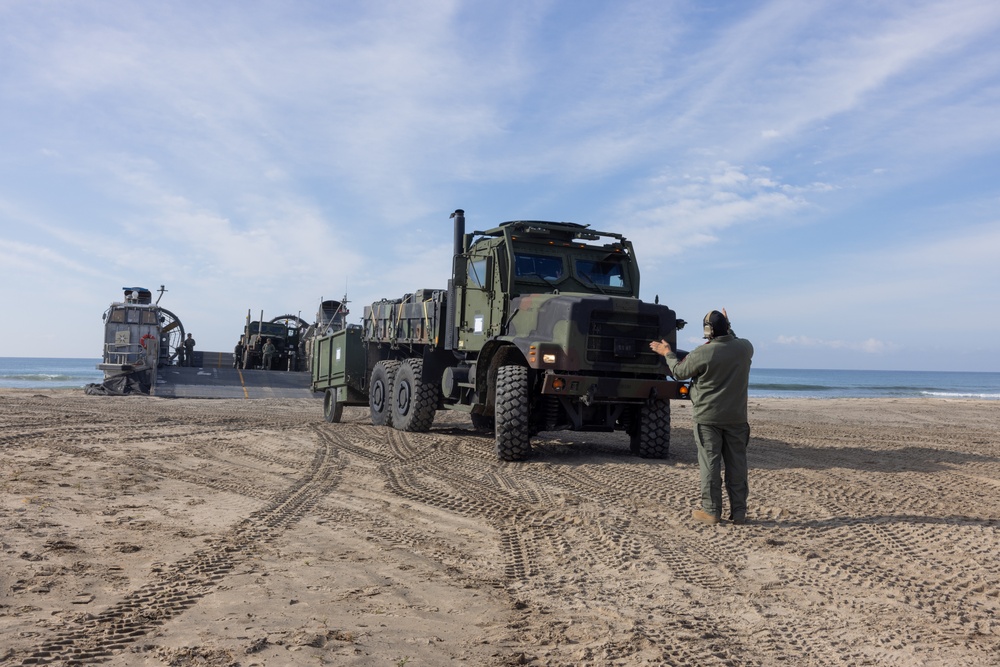 11th MEU Marines and Sailors embark equipment prior to a ship to shore movement