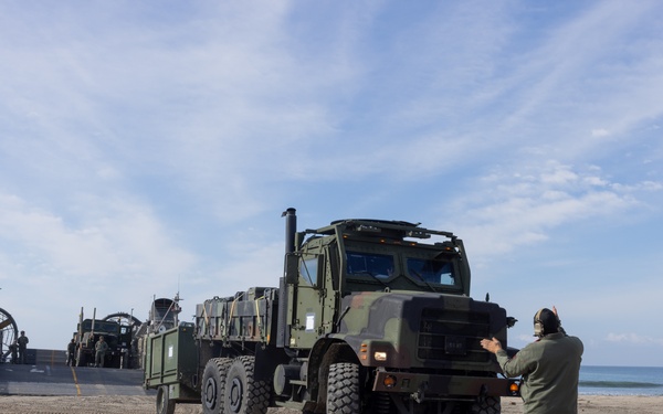11th MEU Marines and Sailors embark equipment prior to a ship to shore movement