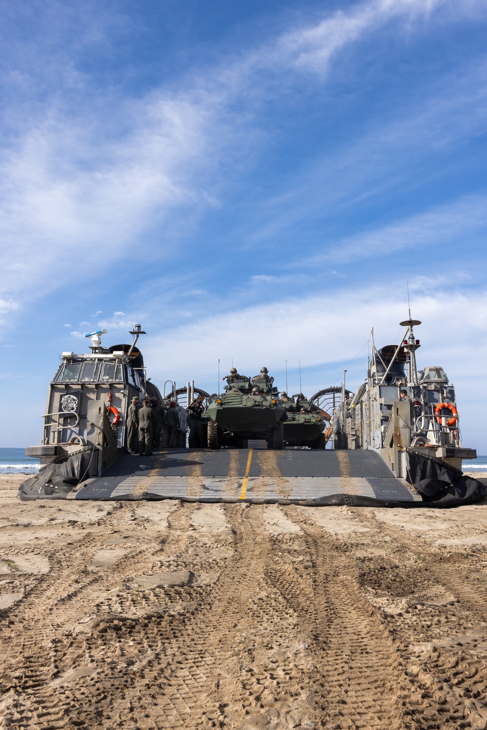 11th MEU Marines and Sailors embark equipment prior to a ship to shore movement
