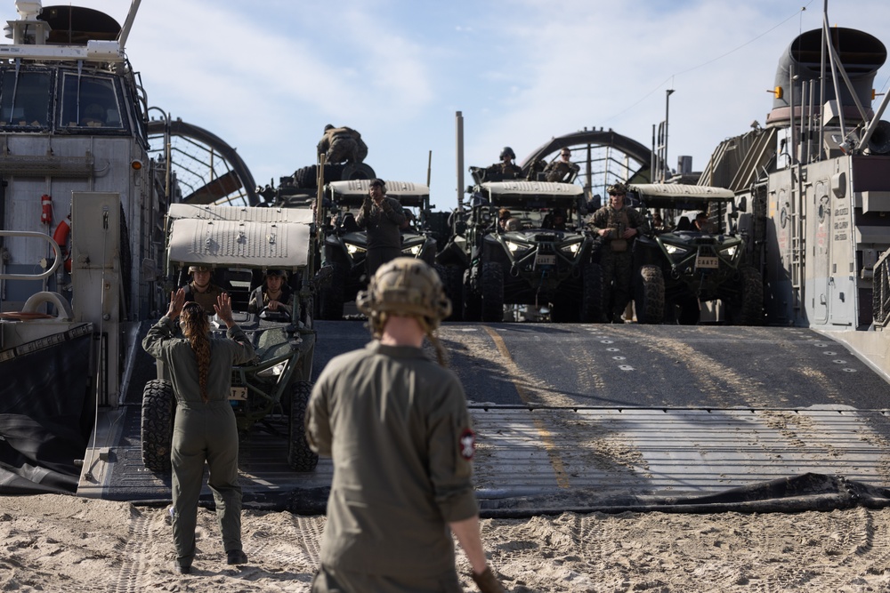 11th MEU Marines and Sailors embark equipment prior to a ship to shore movement