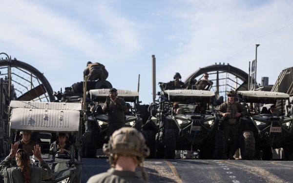 11th MEU Marines and Sailors embark equipment prior to a ship to shore movement