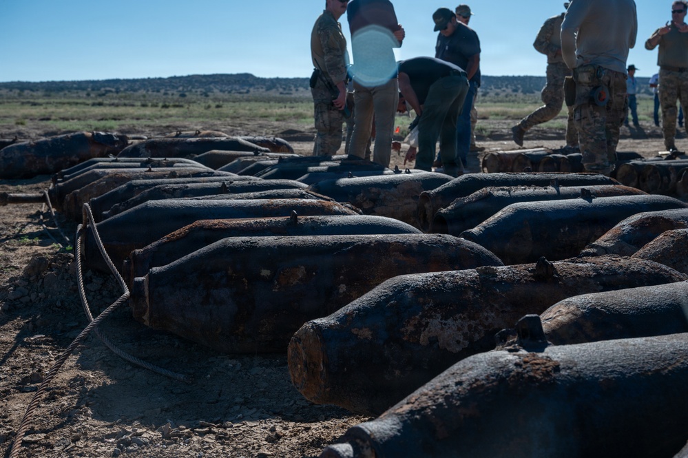 Decades-old training munitions recovered on former range land sit staged for inspection during an explosive ordnance disposal sweep on the Pueblo of Isleta, N.M.