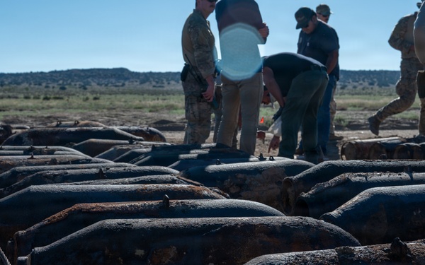 Decades-old training munitions recovered on former range land sit staged for inspection during an explosive ordnance disposal sweep on the Pueblo of Isleta, N.M.