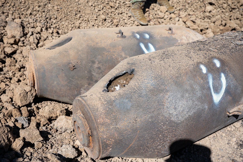 Two WWII-era training munitions rest in place after explosive ordnance disposal technicians safely vented and disabled them during a clearance operation on the Pueblo of Isleta, N.M.