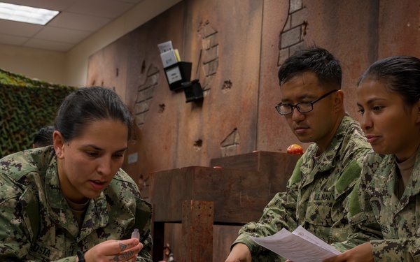 Sailors enrolled in the Hospital Corpsman Basic Course conduct combat lifesaver training.