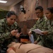 Sailors enrolled in the Hospital Corpsman Basic Course conduct combat lifesaver training.