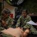 Sailors enrolled in the Hospital Corpsman Basic Course conduct combat lifesaver training.