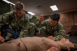 Sailors enrolled in the Hospital Corpsman Basic Course conduct combat lifesaver training.
