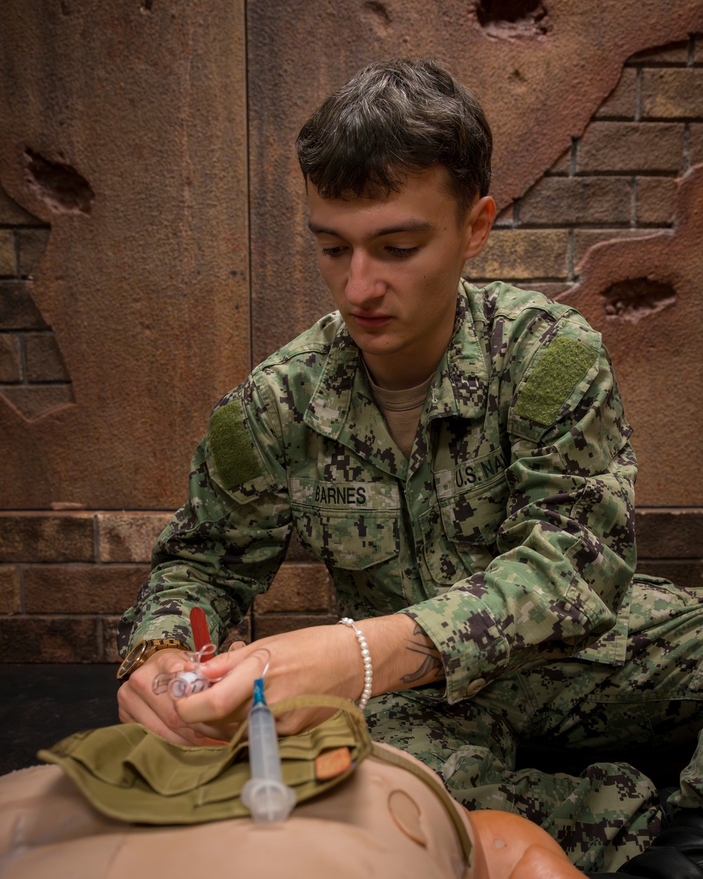 Sailors enrolled in the Hospital Corpsman Basic Course conduct combat lifesaver training.