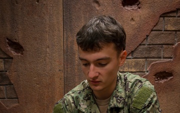 Sailors enrolled in the Hospital Corpsman Basic Course conduct combat lifesaver training.