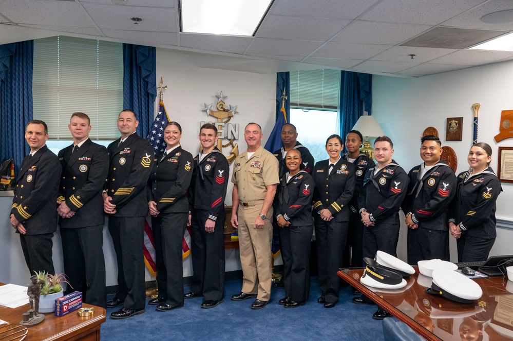 Master Chief Petty Officer of the Navy John J. Perryman poses for a with the fiscal year 2025 Recruiter of the Year awardees during a visit to the Pentagon