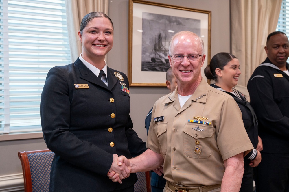 Adm. Daryl Caudle, Chief of Naval Operations, congratulates the fiscal year 2025 Recruiter of the Year awardees during a visit to the Pentagon