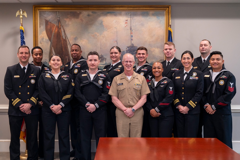 Adm. Daryl Caudle, Chief of Naval Operations, poses for a with the fiscal year 2025 Recruiter of the Year awardees during a visit to the Pentagon