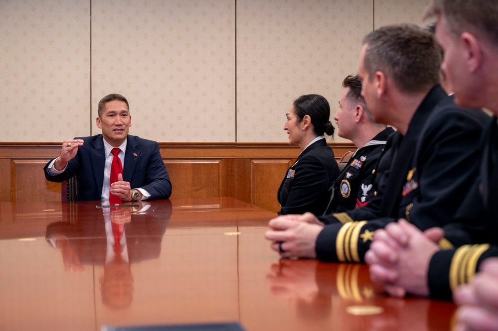 The Honorable Hung Cao, Under Secretary of the Navy, speaks with the fiscal year 2025 Recruiter of the Year awardees during a visit to the Pentagon
