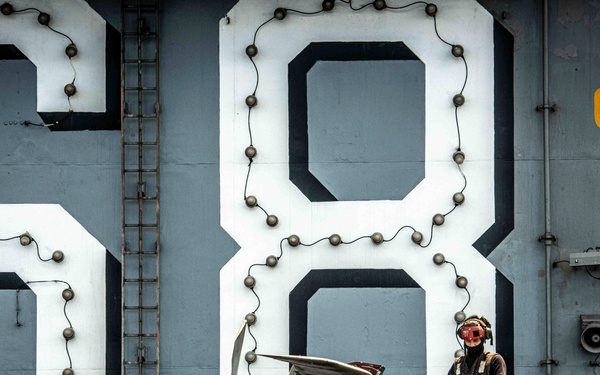 Nimitz Sailor Washes Aircraft