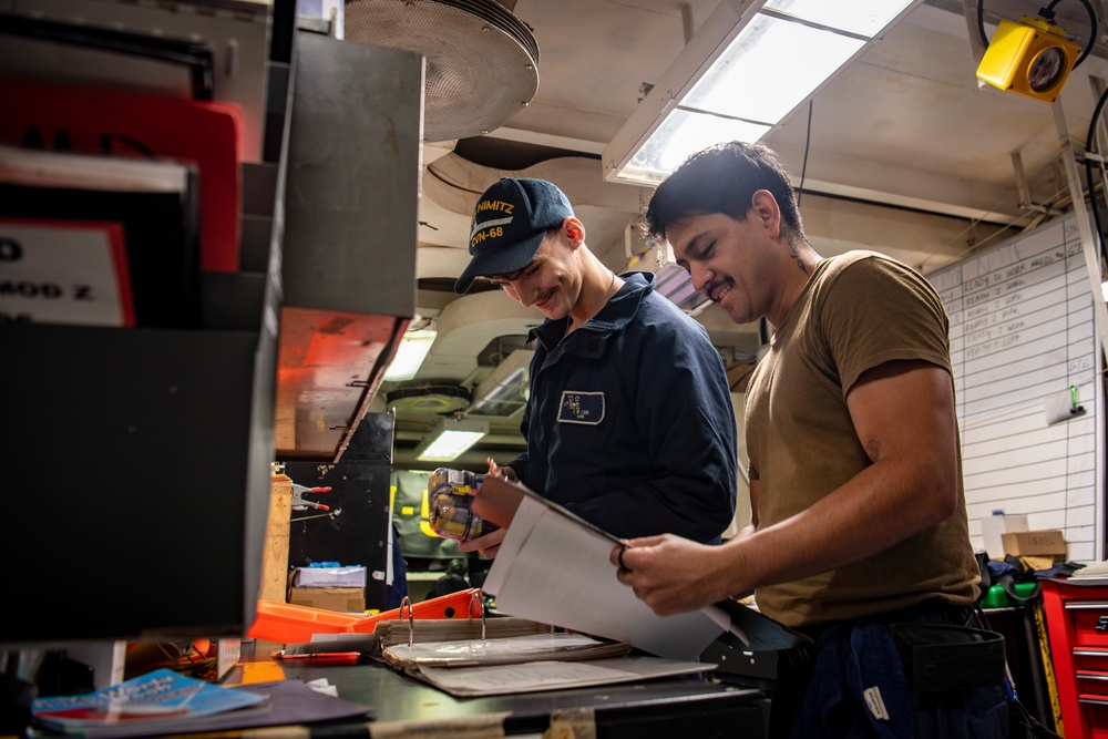 Nimitz Sailors Conduct Float Coat Maintenance