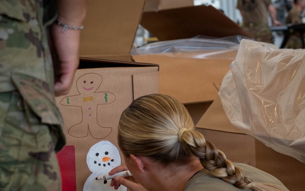 Service members, volunteers, families prepare bundles for OCD25