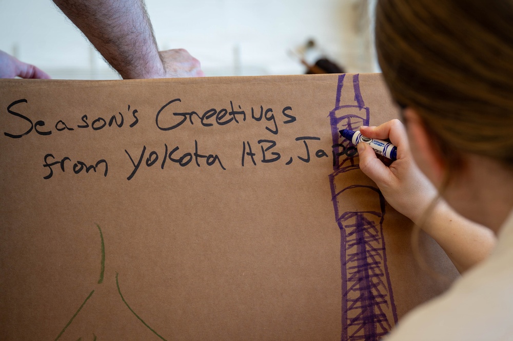 Service members, volunteers, families prepare bundles for OCD25