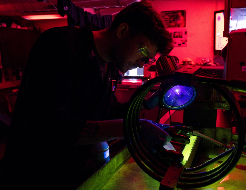 Nimitz Sailor Inspects Tie Down Chain Ring