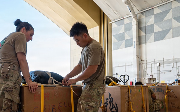 Wrapped up, packed up! 374 AEW readies bundles for OCD25 airdrops