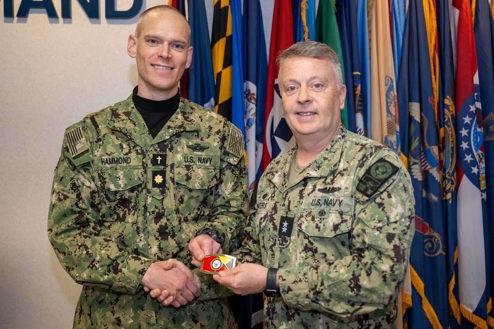 RADM Waters gives Bravo Zulu belt buckles to Chaplains